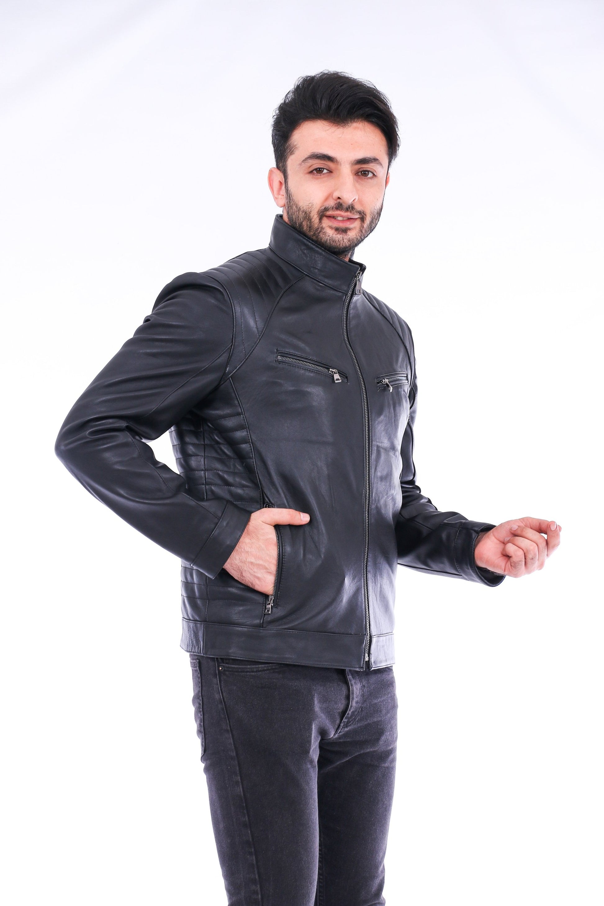 Man wearing a black leather jacket on a white background