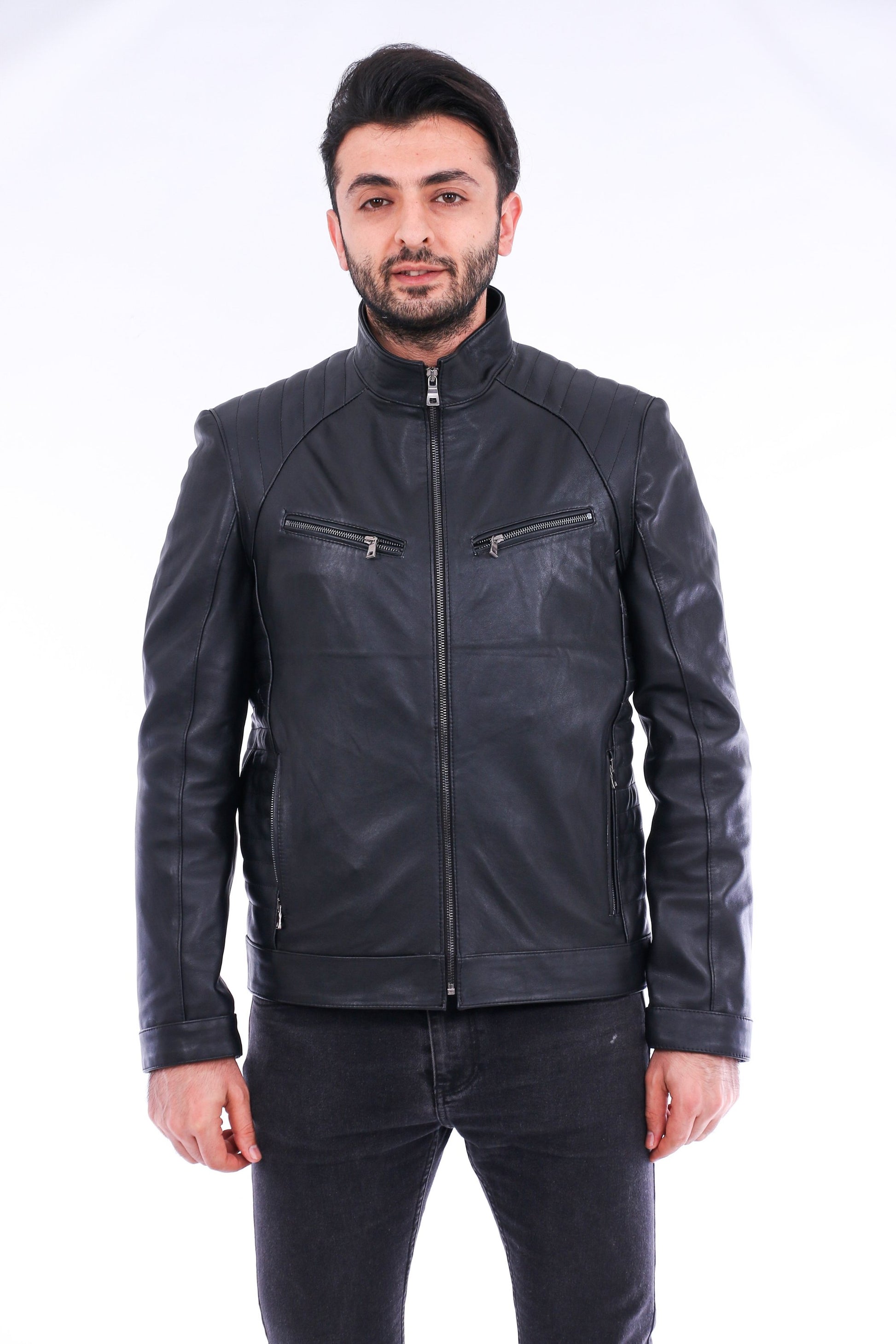 Man wearing a black leather jacket on a white background