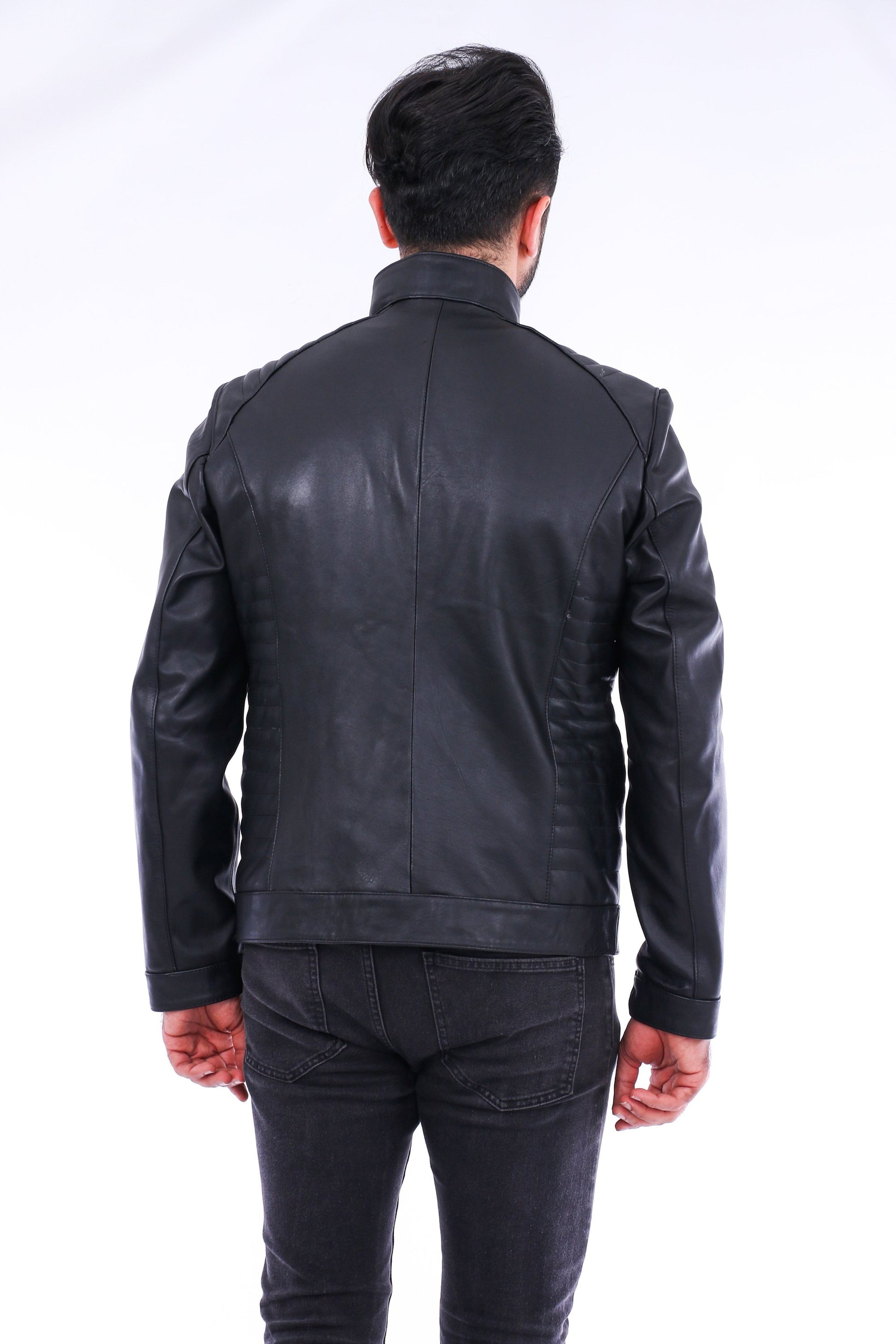 Person wearing a black leather jacket on a white background