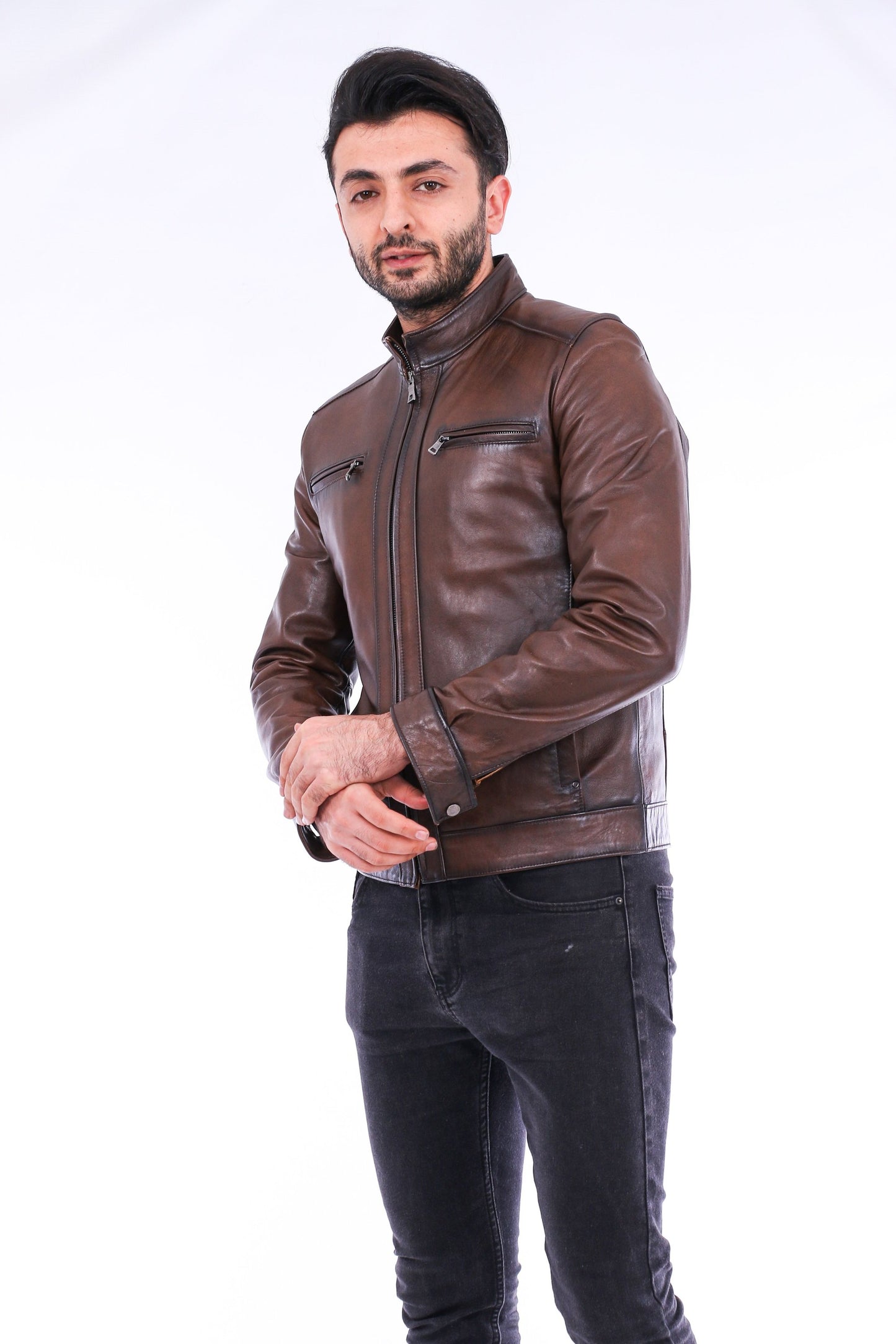 Man wearing a brown leather jacket on a white background