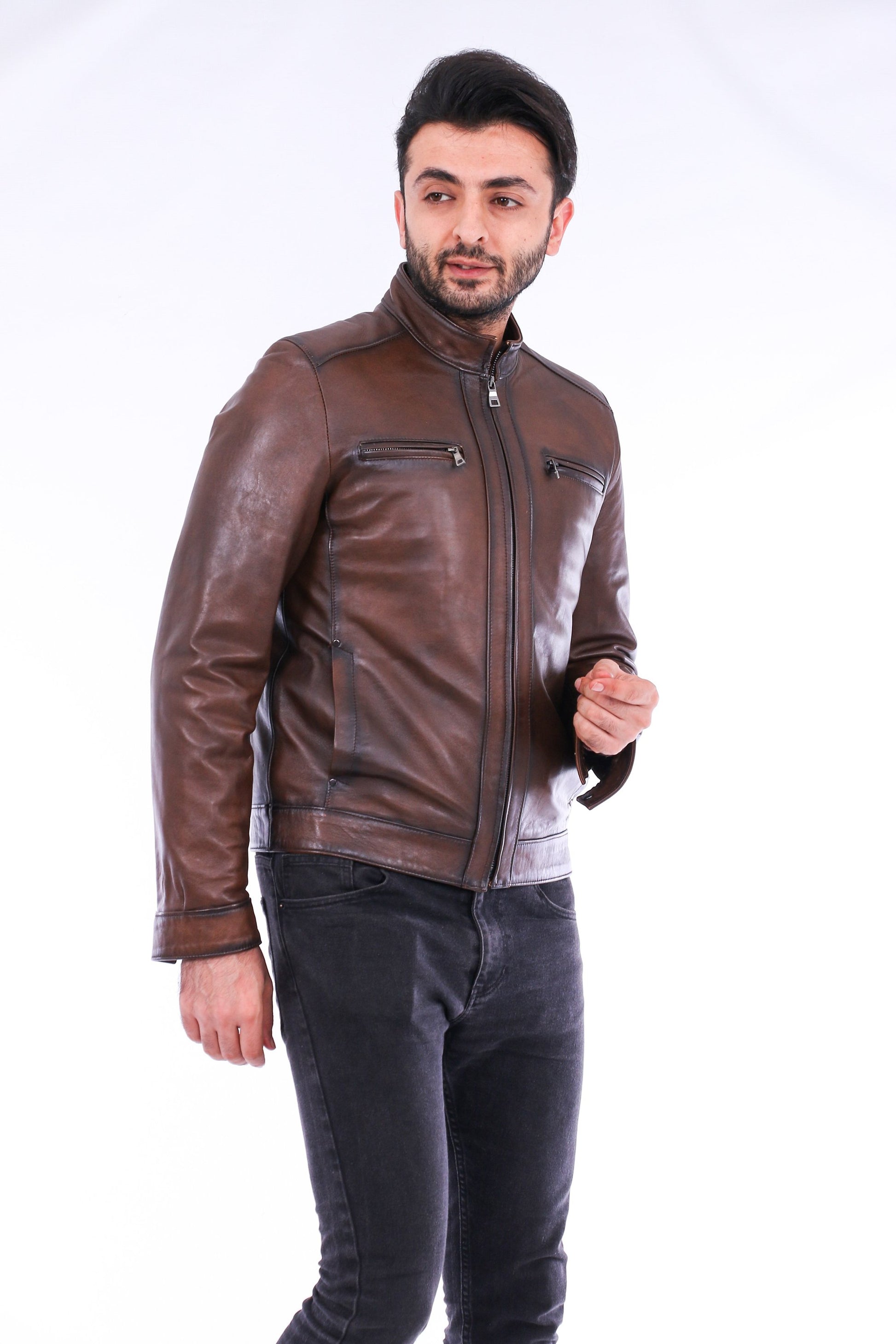 Man wearing a brown leather jacket on a white background