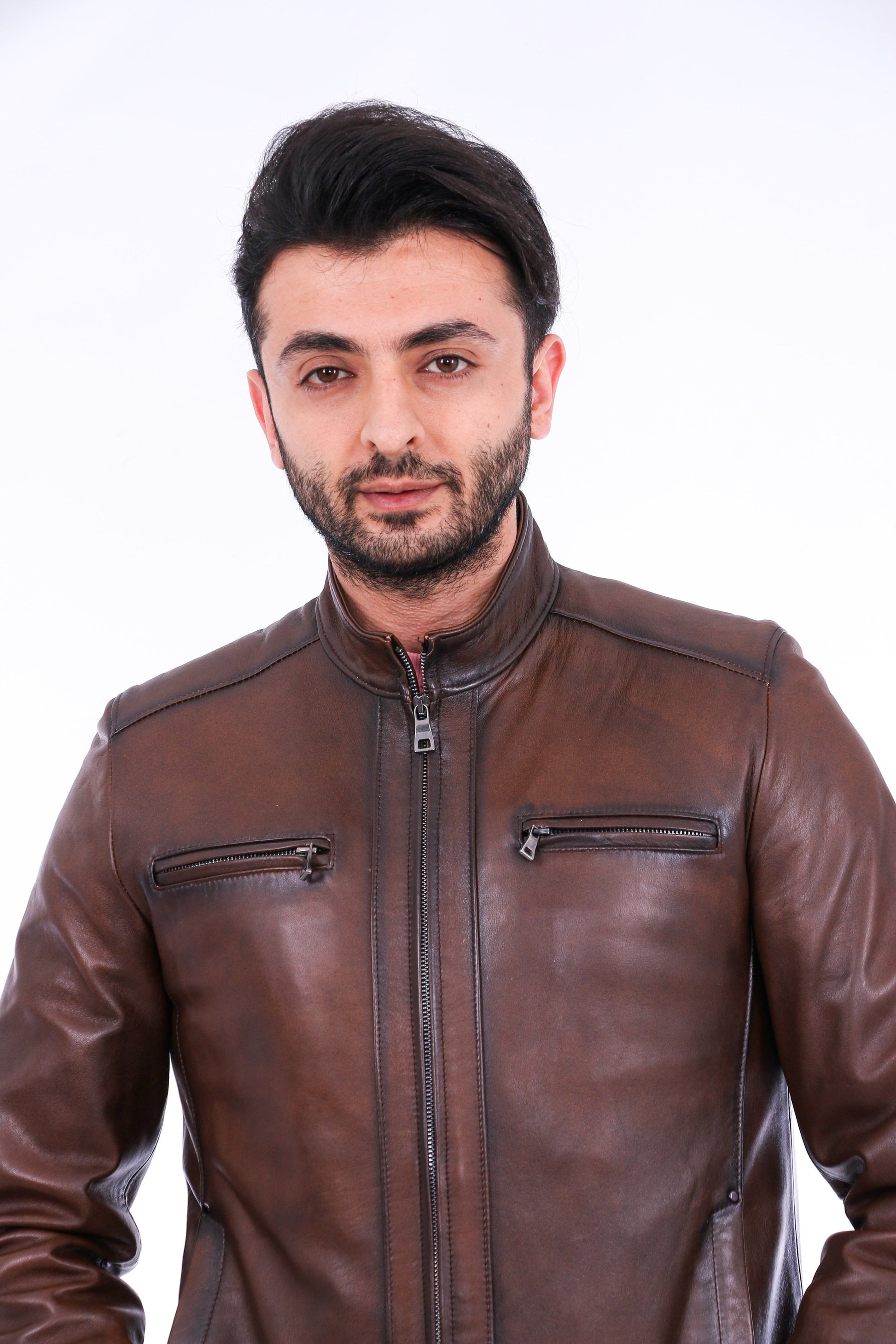 Man wearing a brown leather jacket on a white background