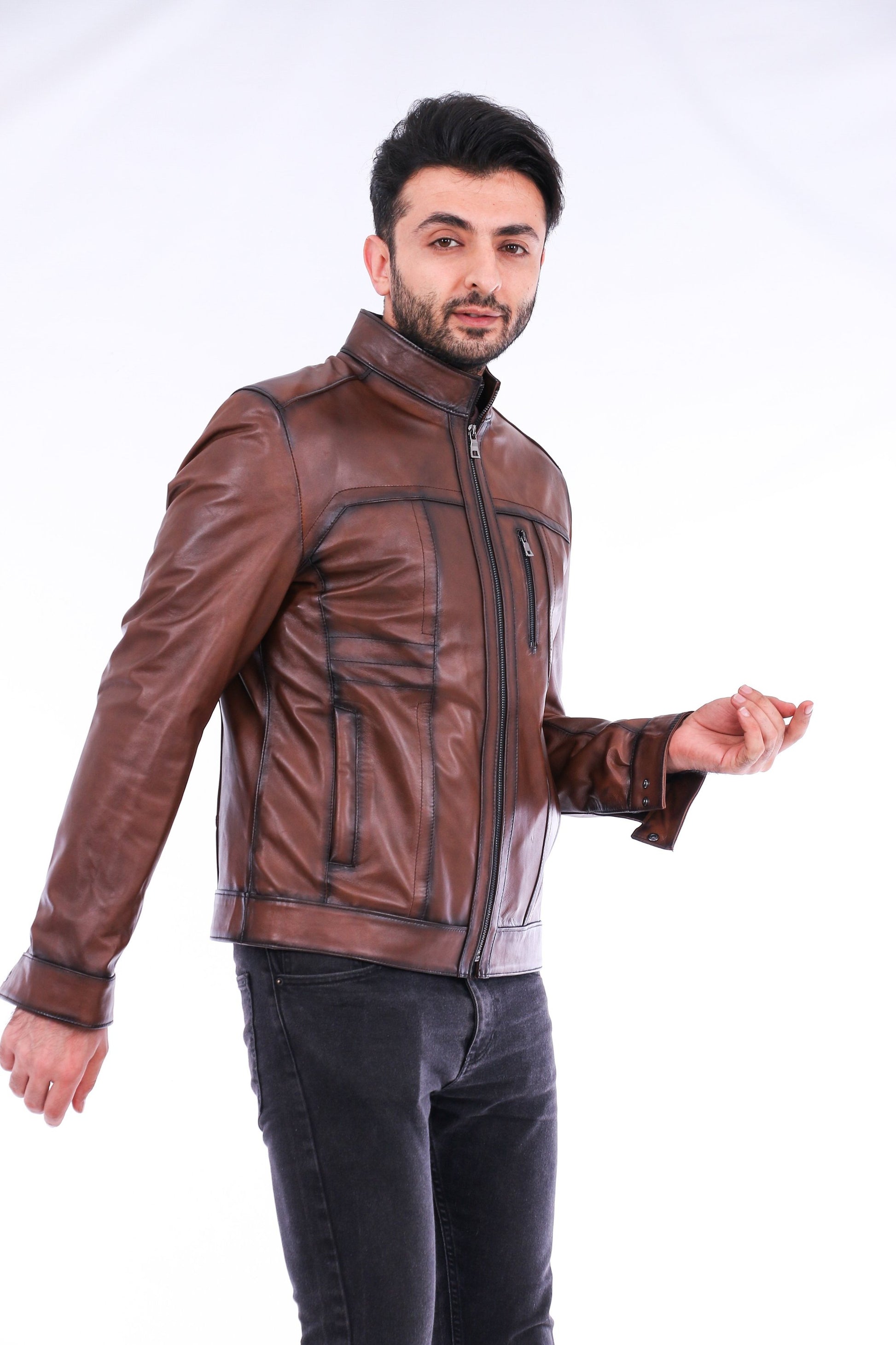 Man wearing a brown leather jacket on a white background