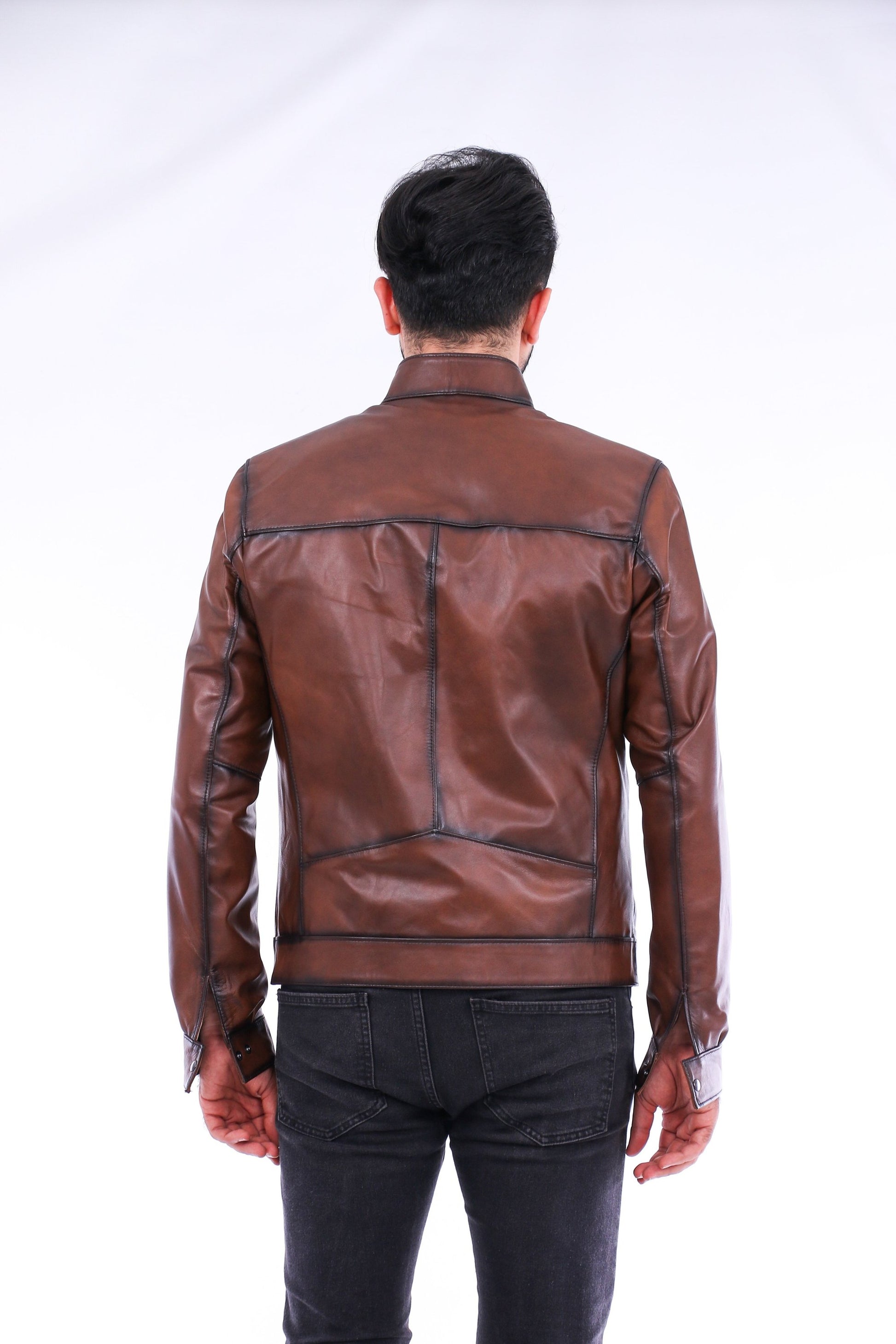 Man wearing a brown leather jacket on a white background