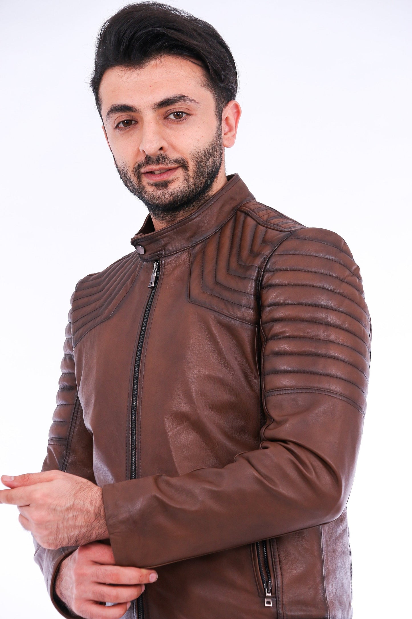 Man wearing a brown leather jacket on a white background