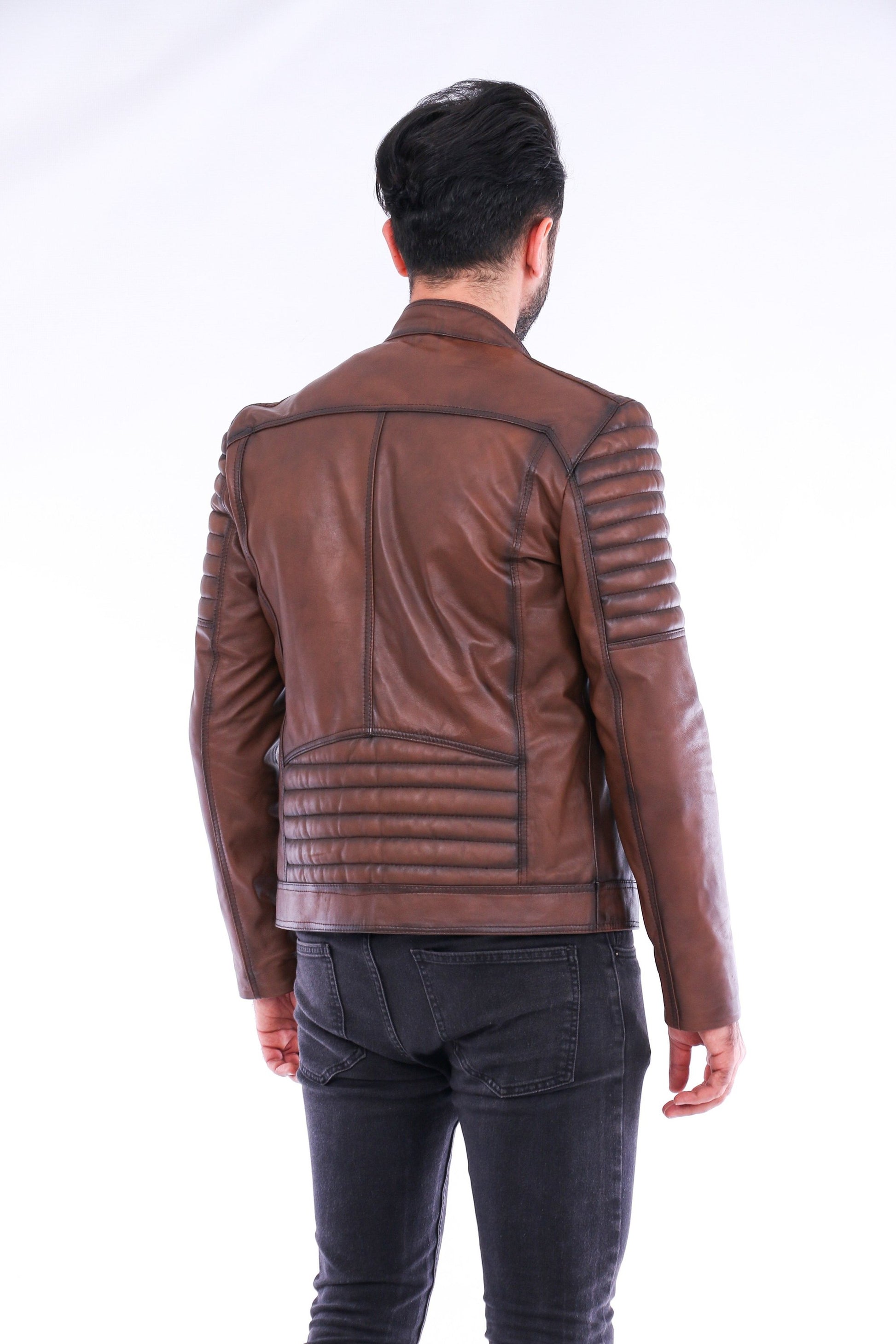 Person wearing a brown leather jacket on a white background