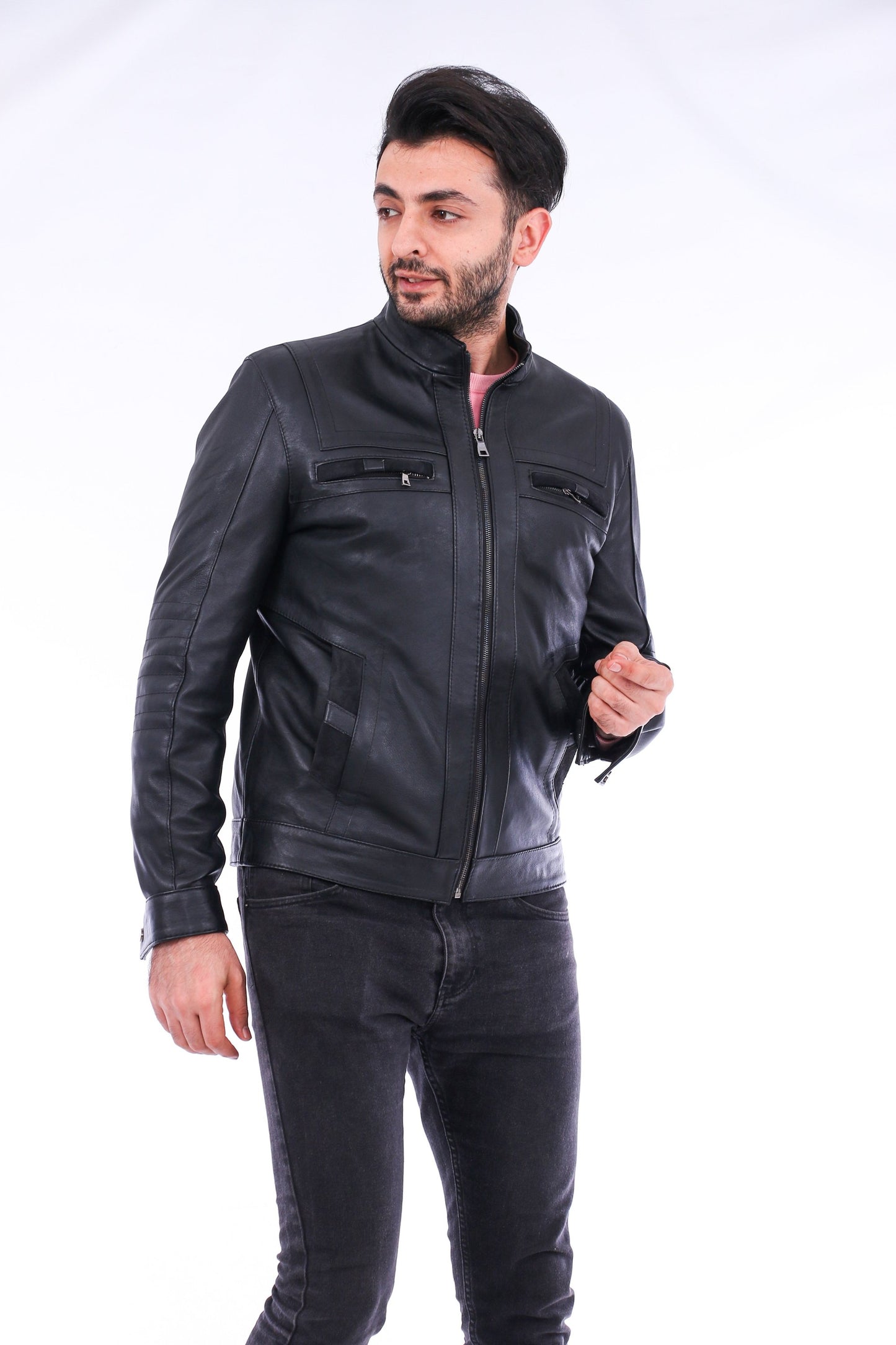 Man wearing a black leather jacket on a white background