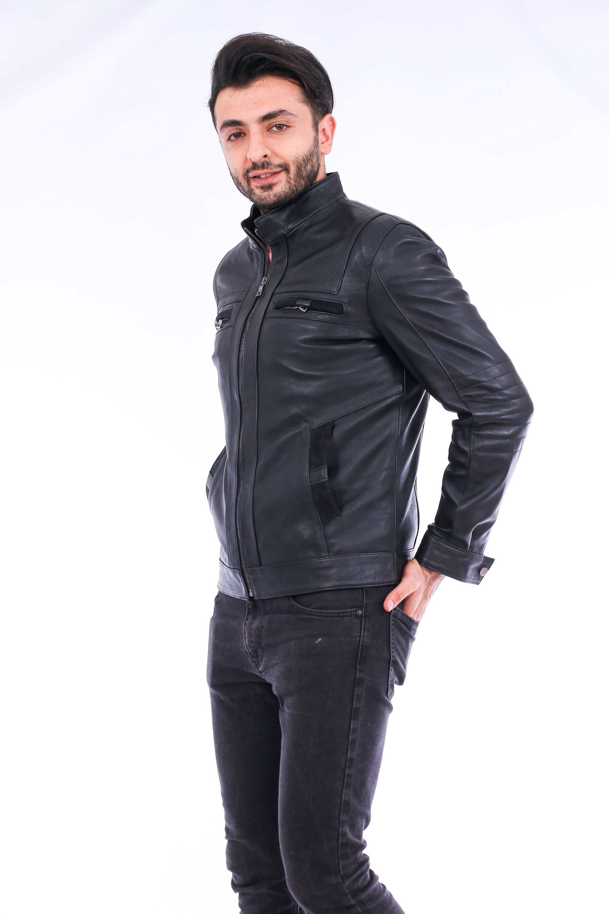 Man wearing a black leather jacket on a white background