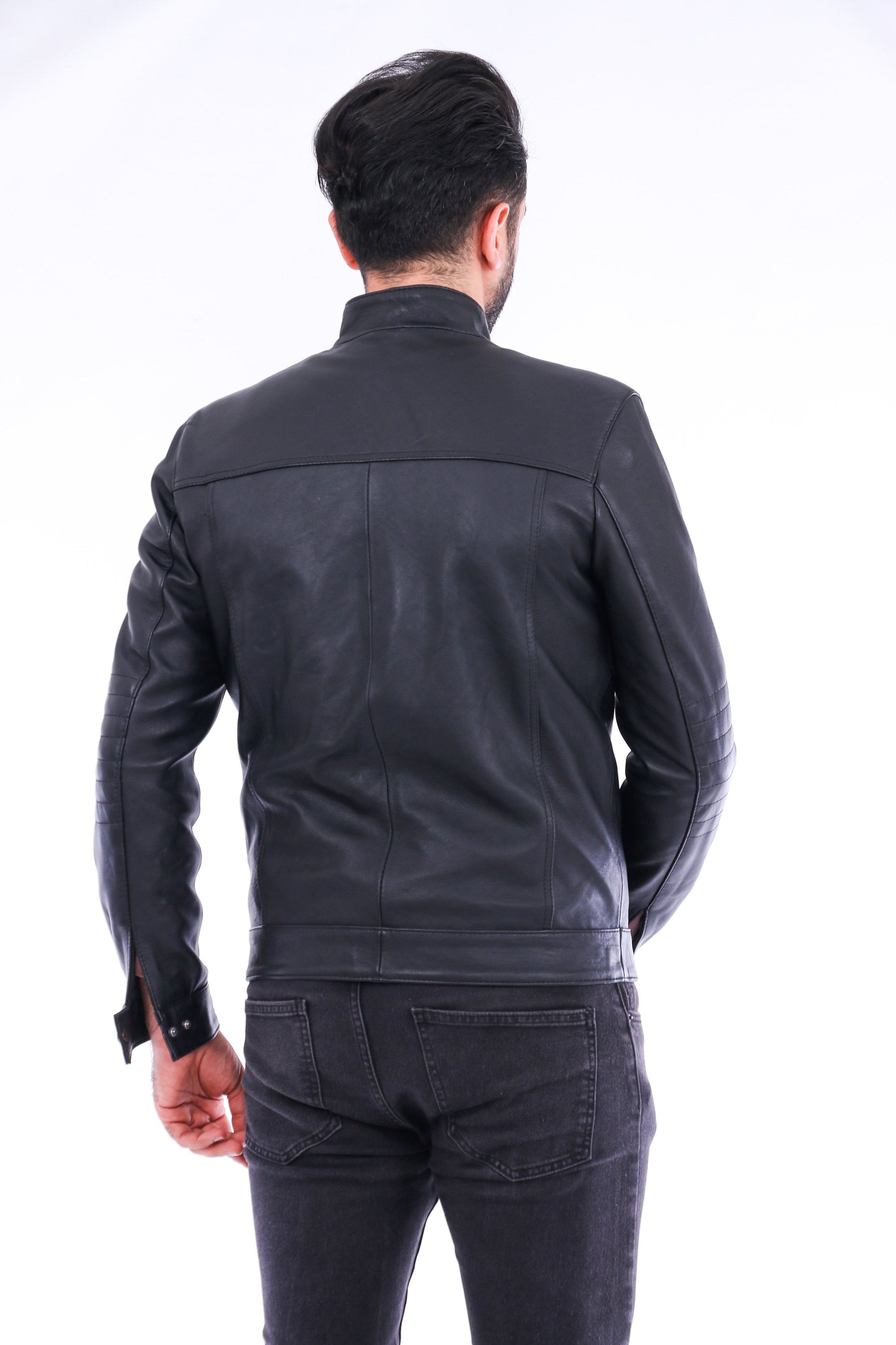 Man wearing a black leather jacket on a white background