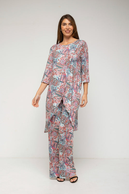 Woman wearing a patterned outfit on a white background