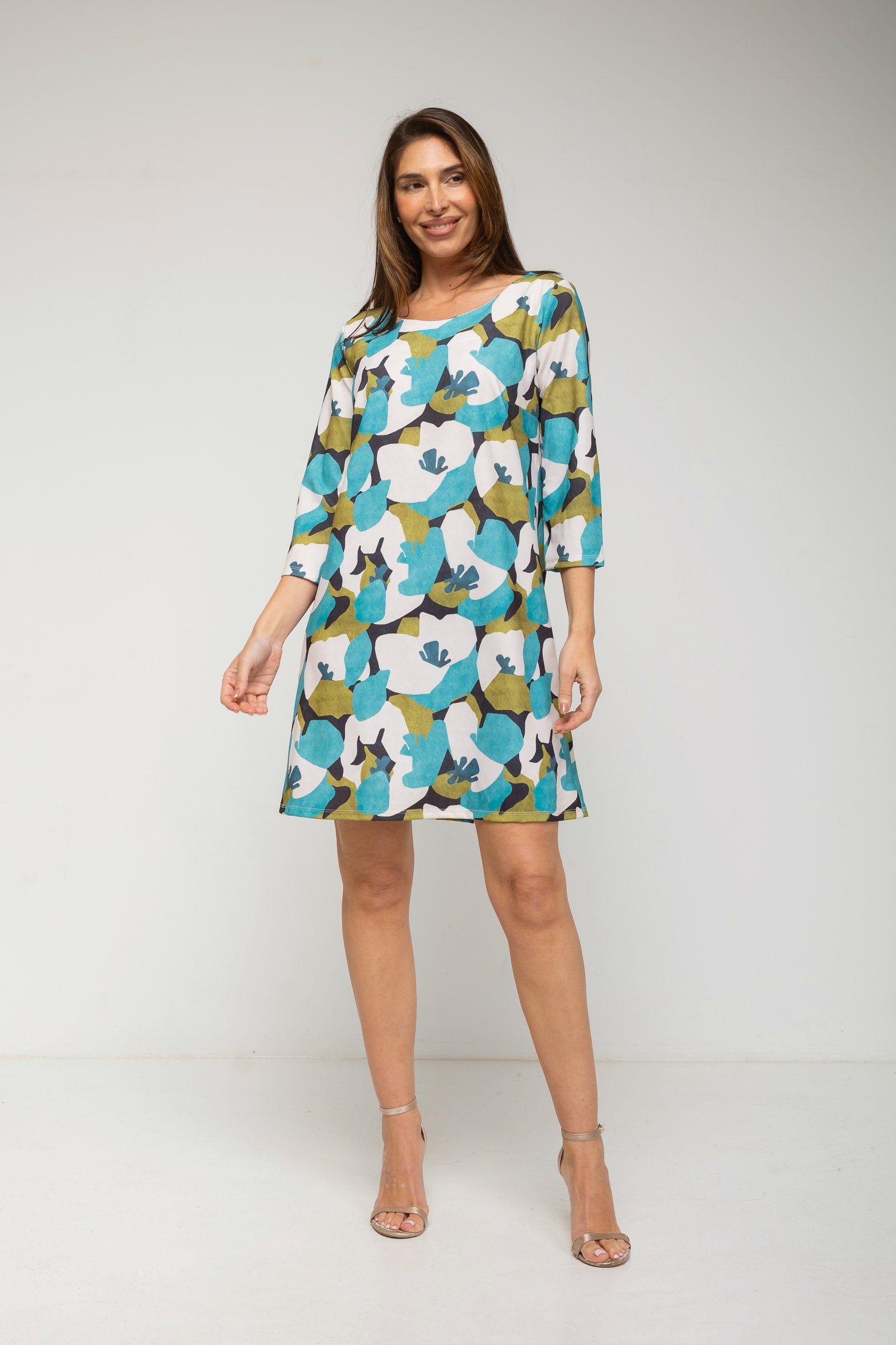 Woman wearing a floral dress on a white background