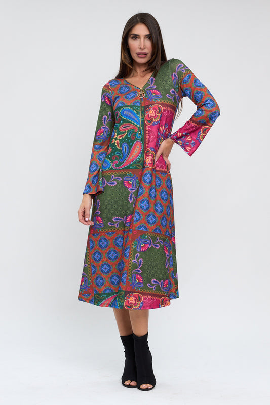 Woman wearing a colorful patterned dress on a white background