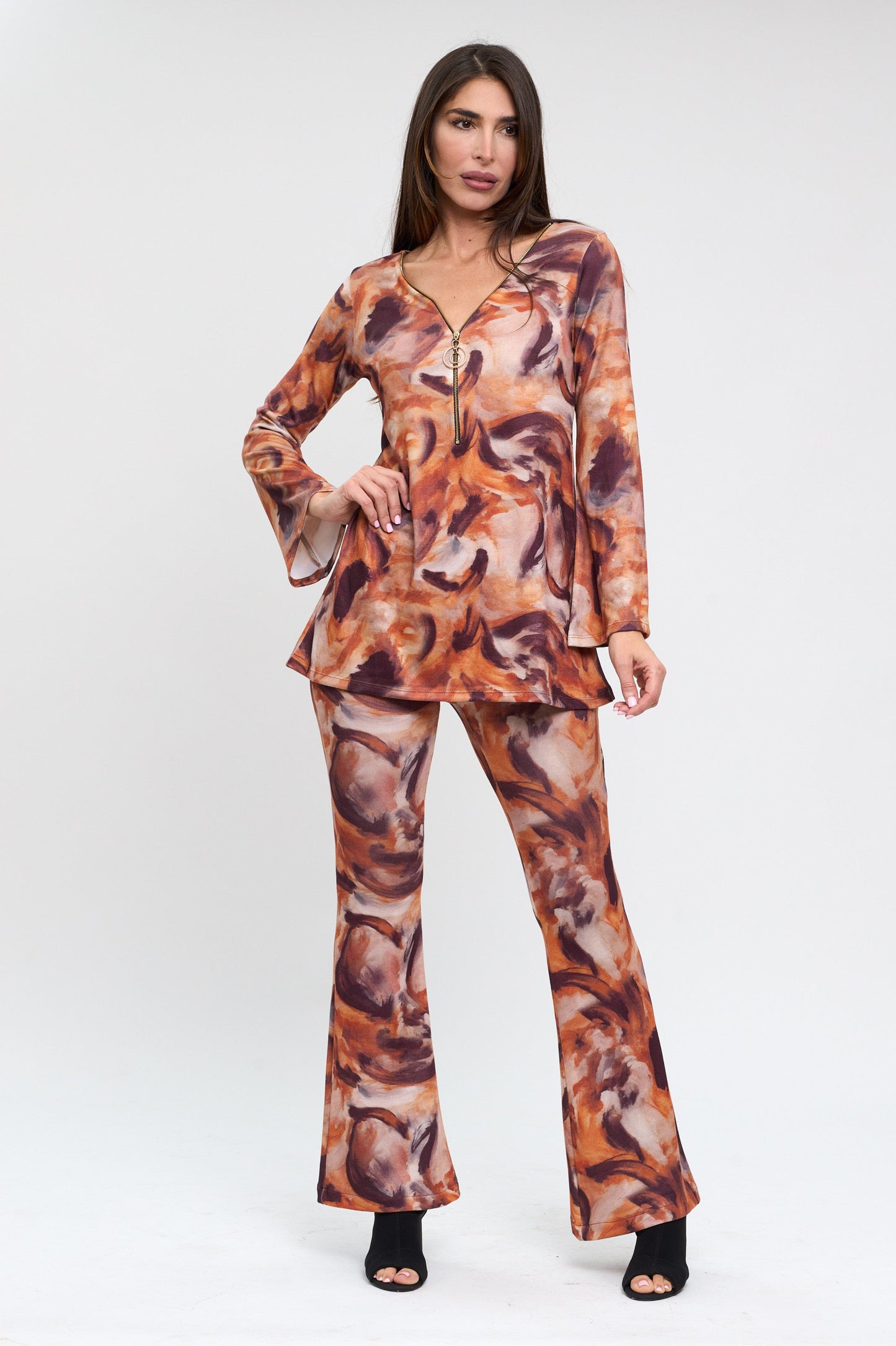 Woman wearing a patterned outfit on a white background