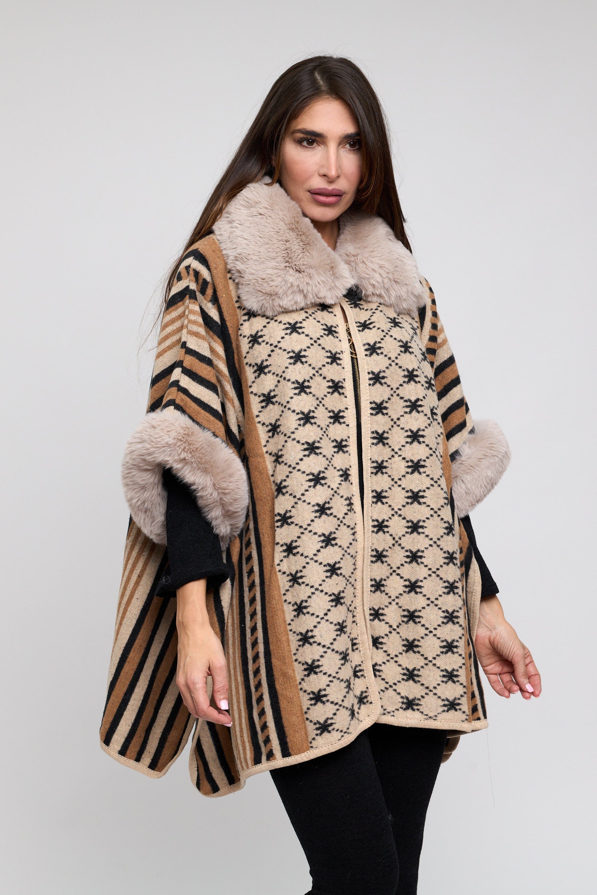 Woman wearing a patterned coat with fur trim on a white background
