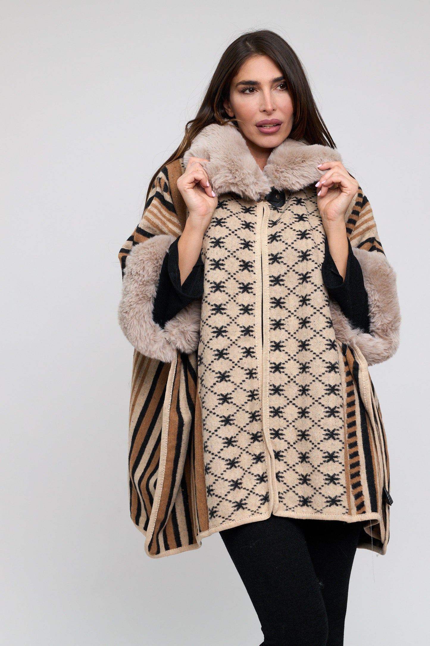 Woman wearing a patterned coat with fur trim on a white background