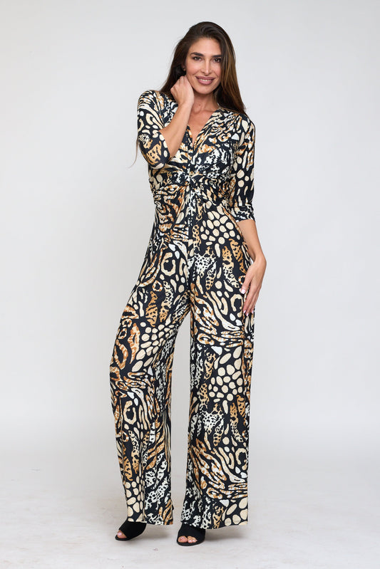 Woman wearing a patterned jumpsuit on a white background