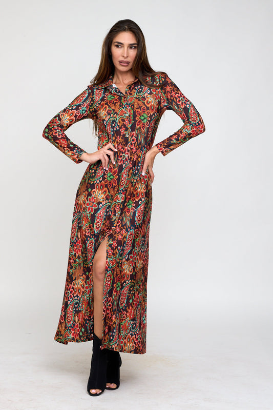 Woman wearing a long, floral-patterned dress on a white background