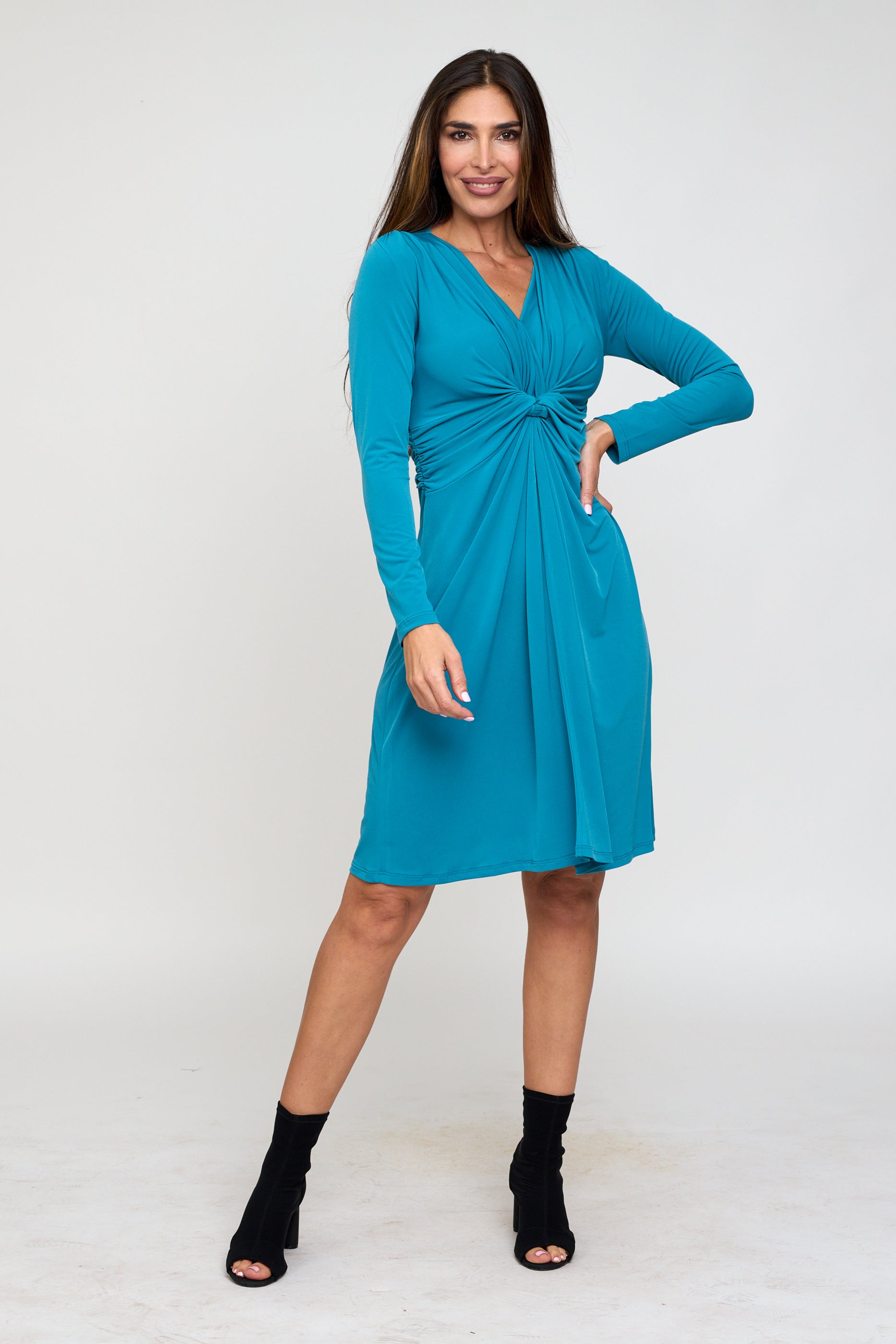 Woman wearing a blue dress on a white background