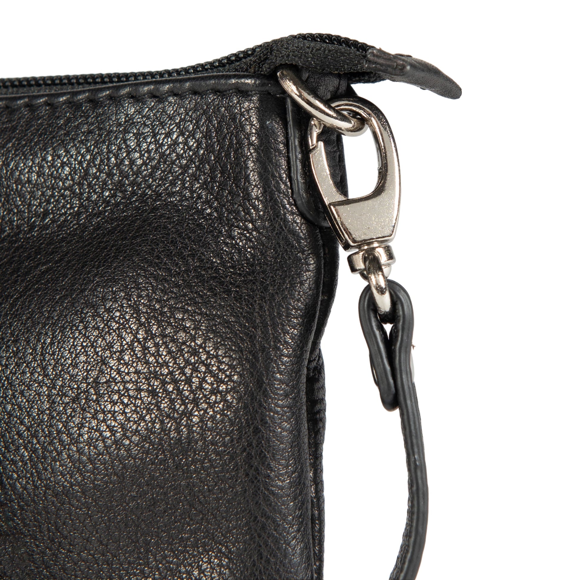 Close-up of a black leather bag with a zipper and strap on a white background