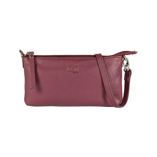 Maroon leather handbag with a strap on a white background