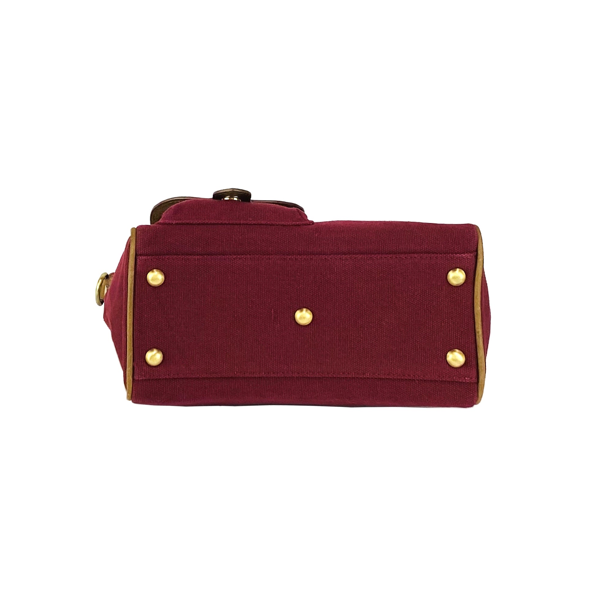 Maroon bag with gold buttons on a white background