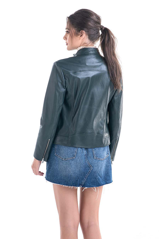 Woman wearing a green leather jacket and blue denim skirt on a white background