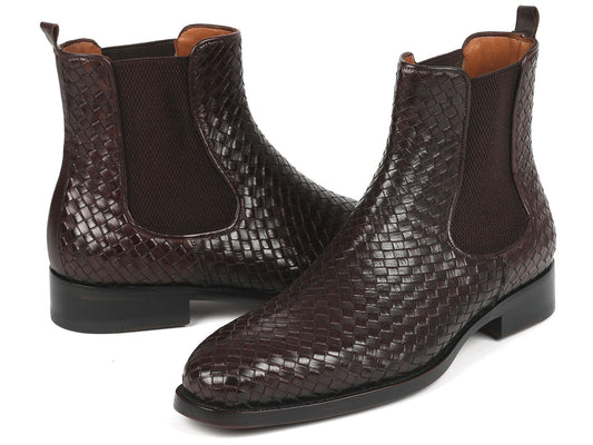 Pair of brown leather Chelsea boots with snake skin pattern on a white background