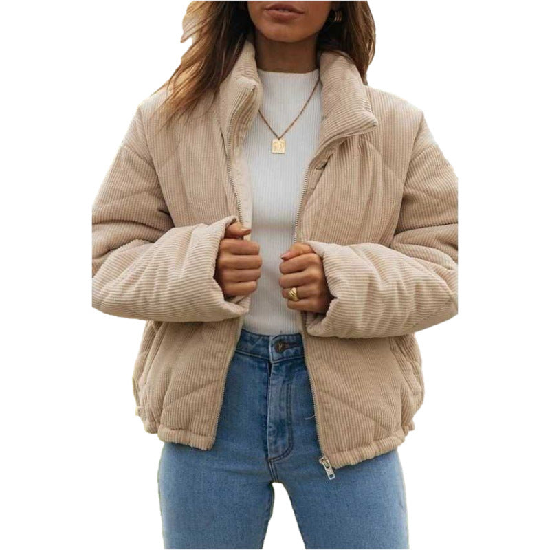 Beige corduroy jacket worn by a person on a white background