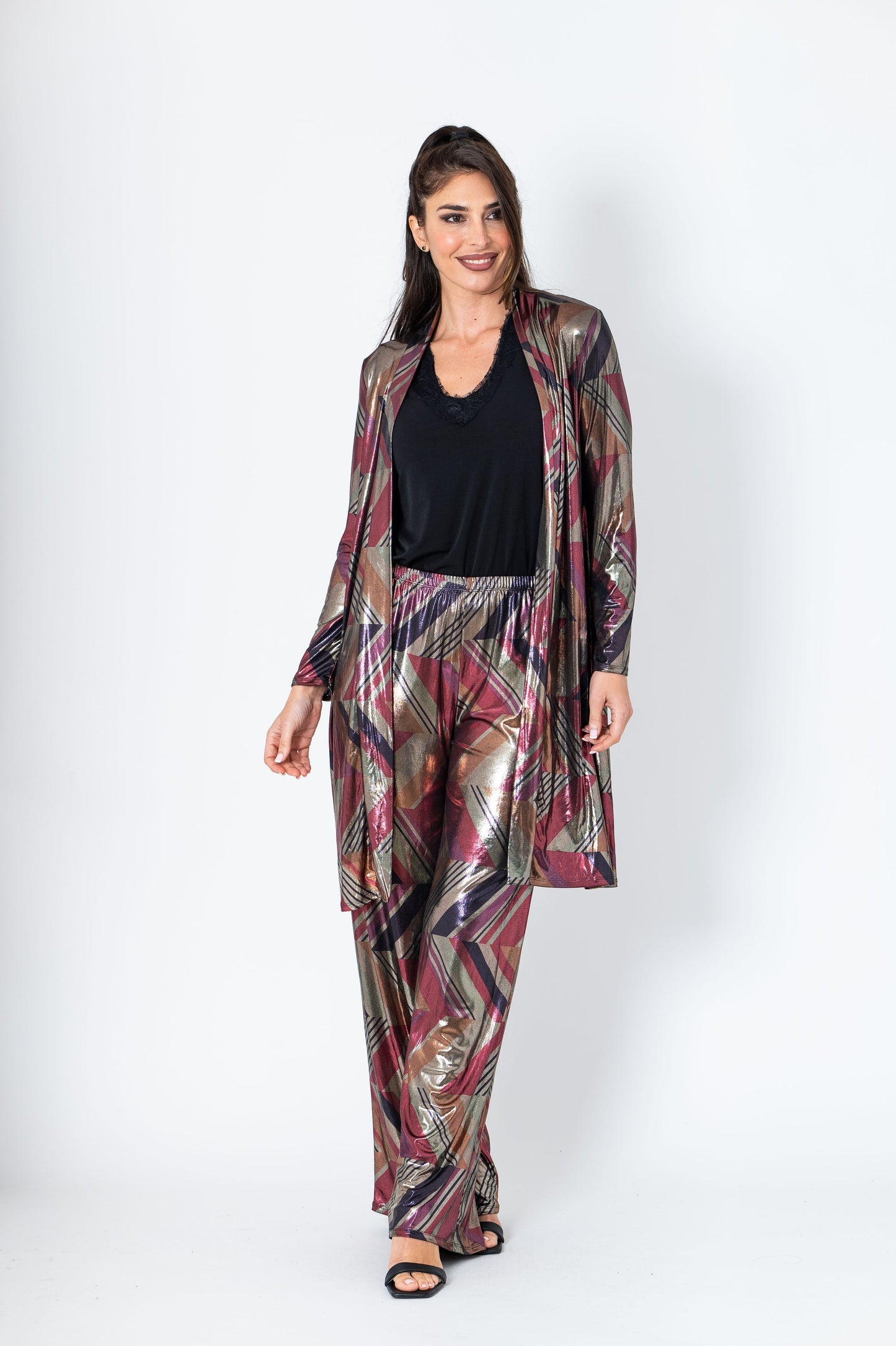 Woman wearing a patterned outfit on a white background