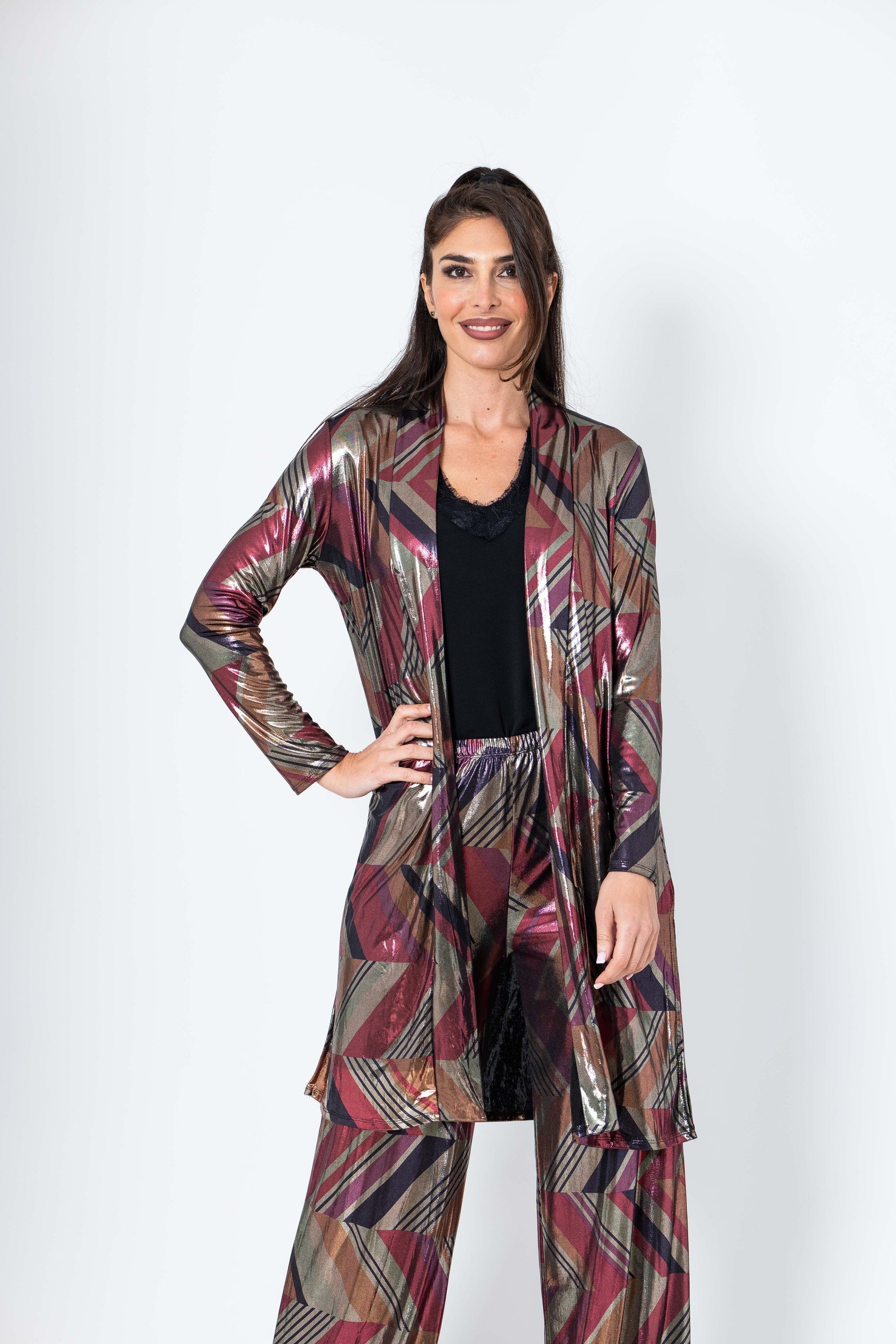 Woman wearing a patterned outfit on a white background