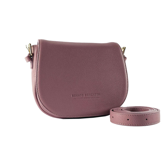 Pink leather saddle bag with matching strap on a white background