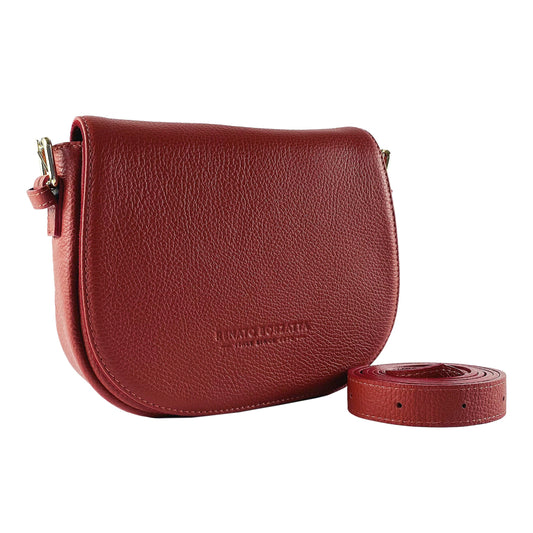 Red leather handbag with matching strap on a white background