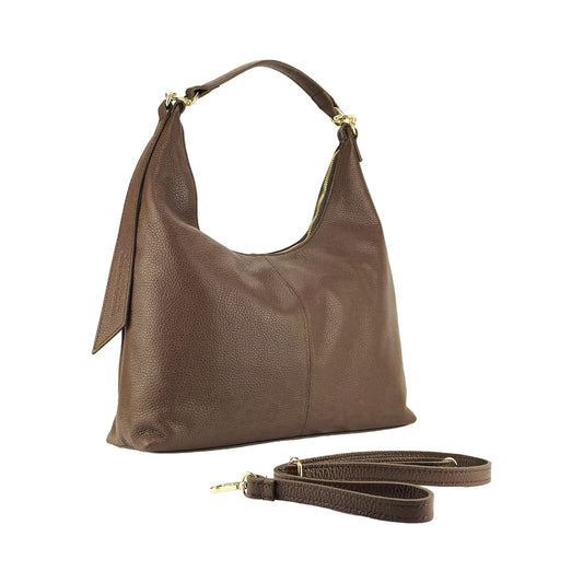 Brown leather handbag with a matching strap on a white background