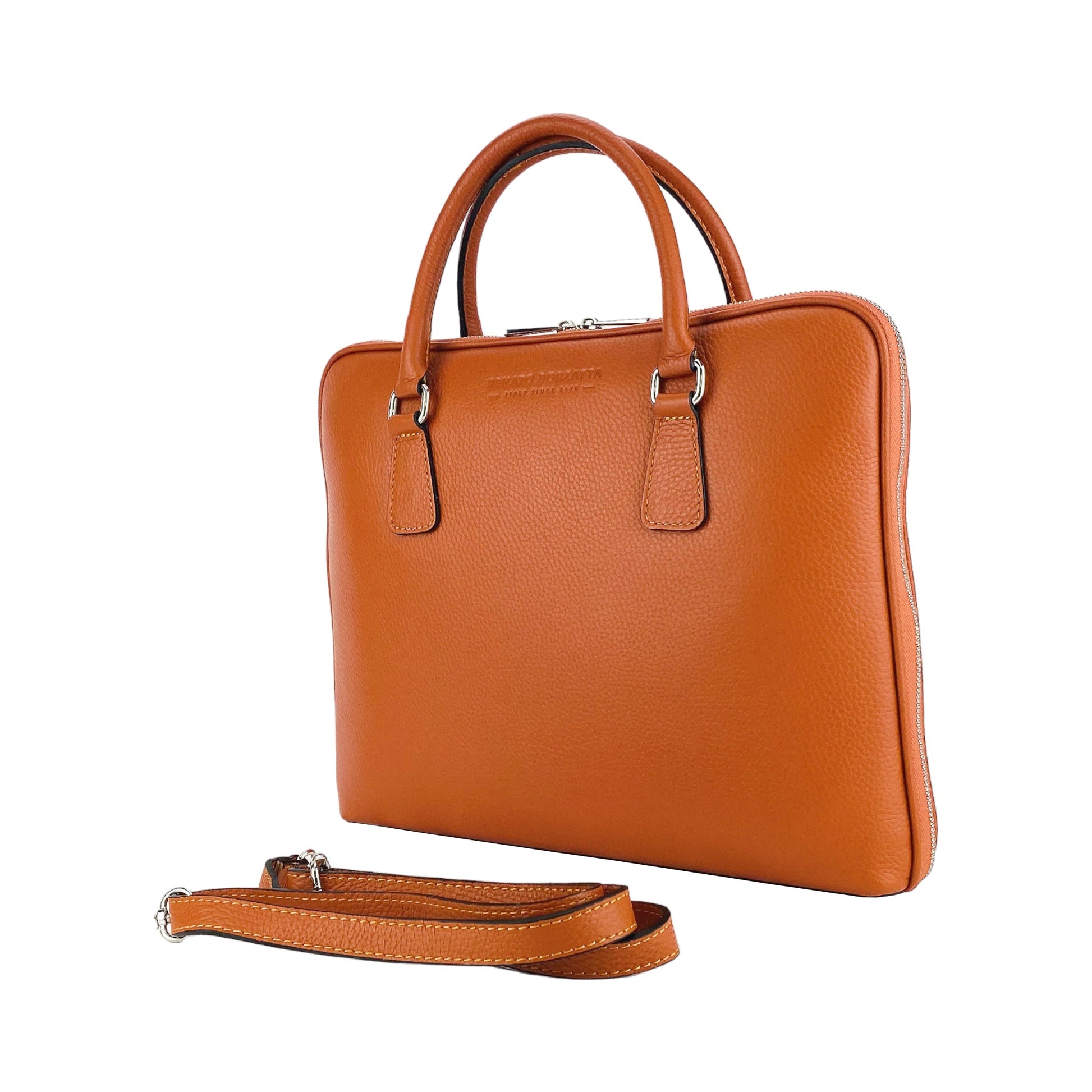 Brown leather handbag with matching strap on a white background