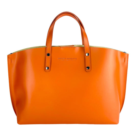 Orange handbag with gold accents on a white background