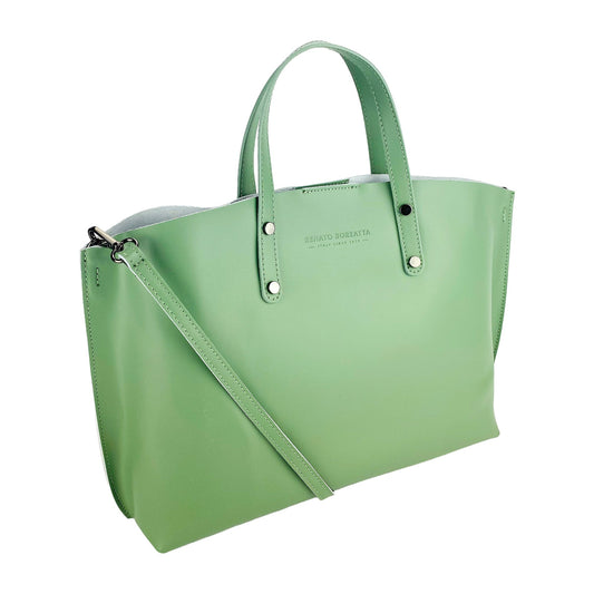 Green handbag with a shoulder strap on a white background