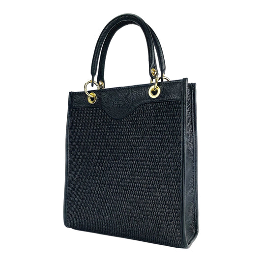 Black woven handbag with gold accents on a white background