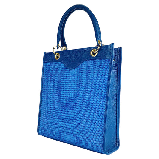 Blue handbag with woven texture and gold accents on a white background