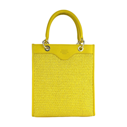 Yellow handbag with textured surface and handle on a white background