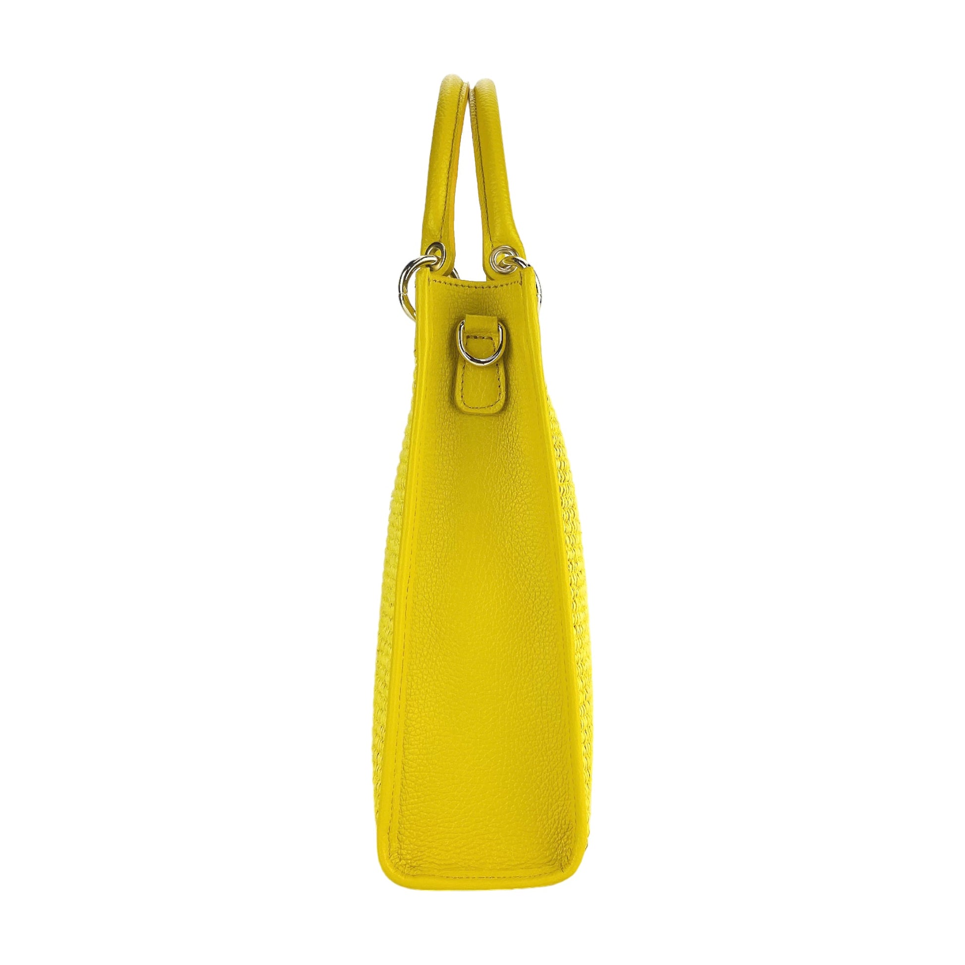 Yellow leather handbag with a strap on a white background