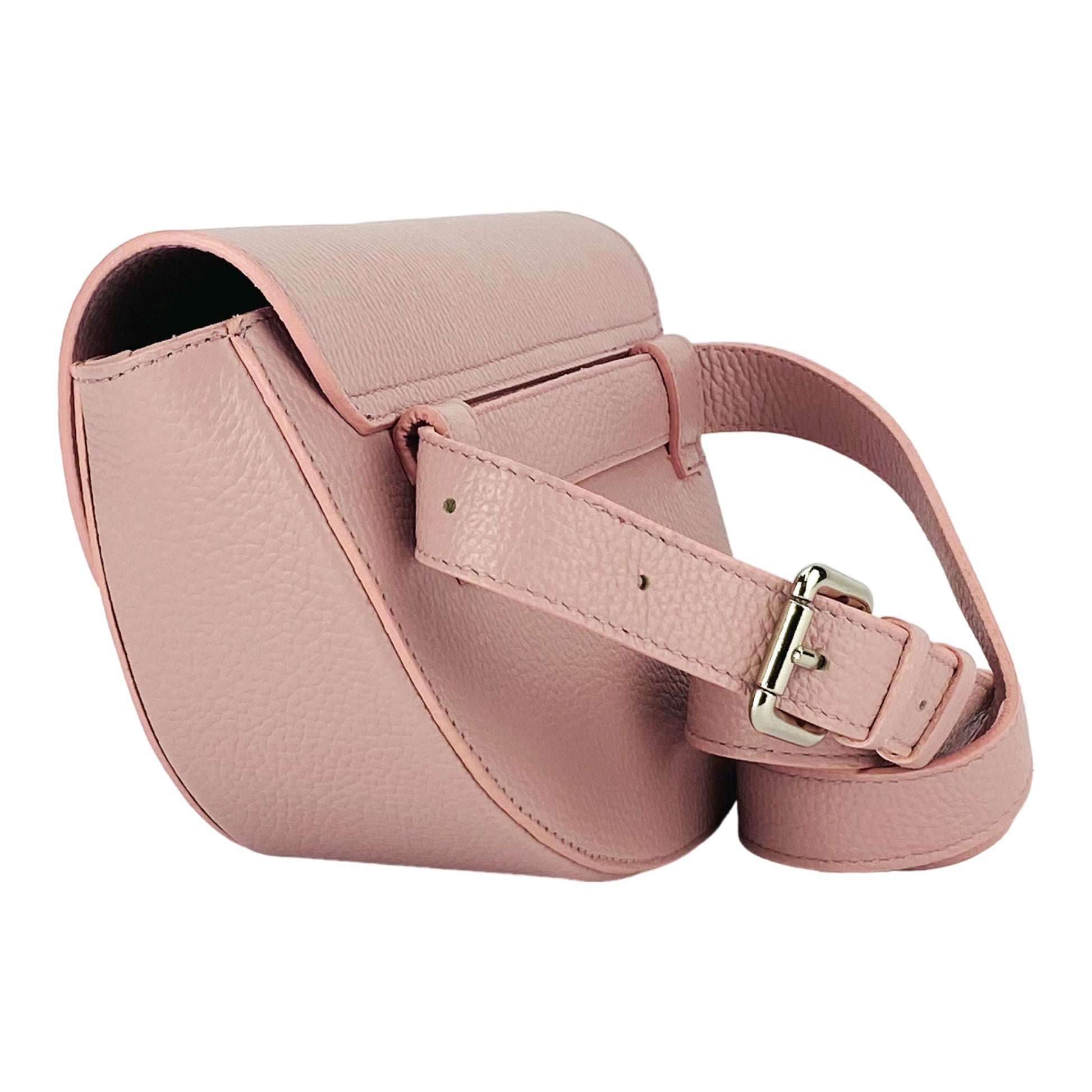 Pink leather saddle bag with a strap on a white background