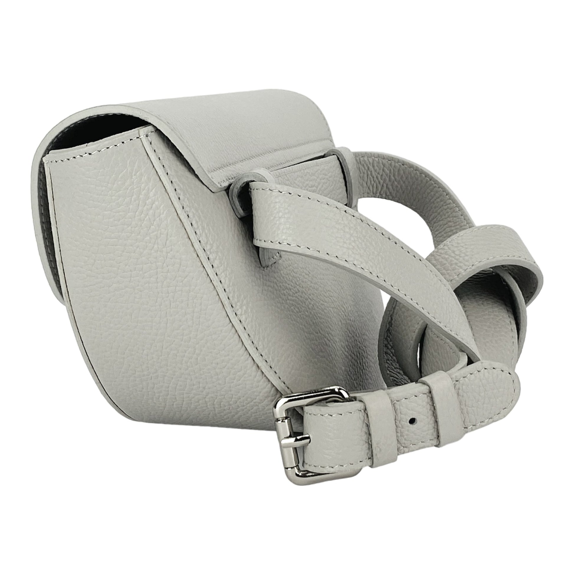 Light gray leather handbag with a strap on a white background