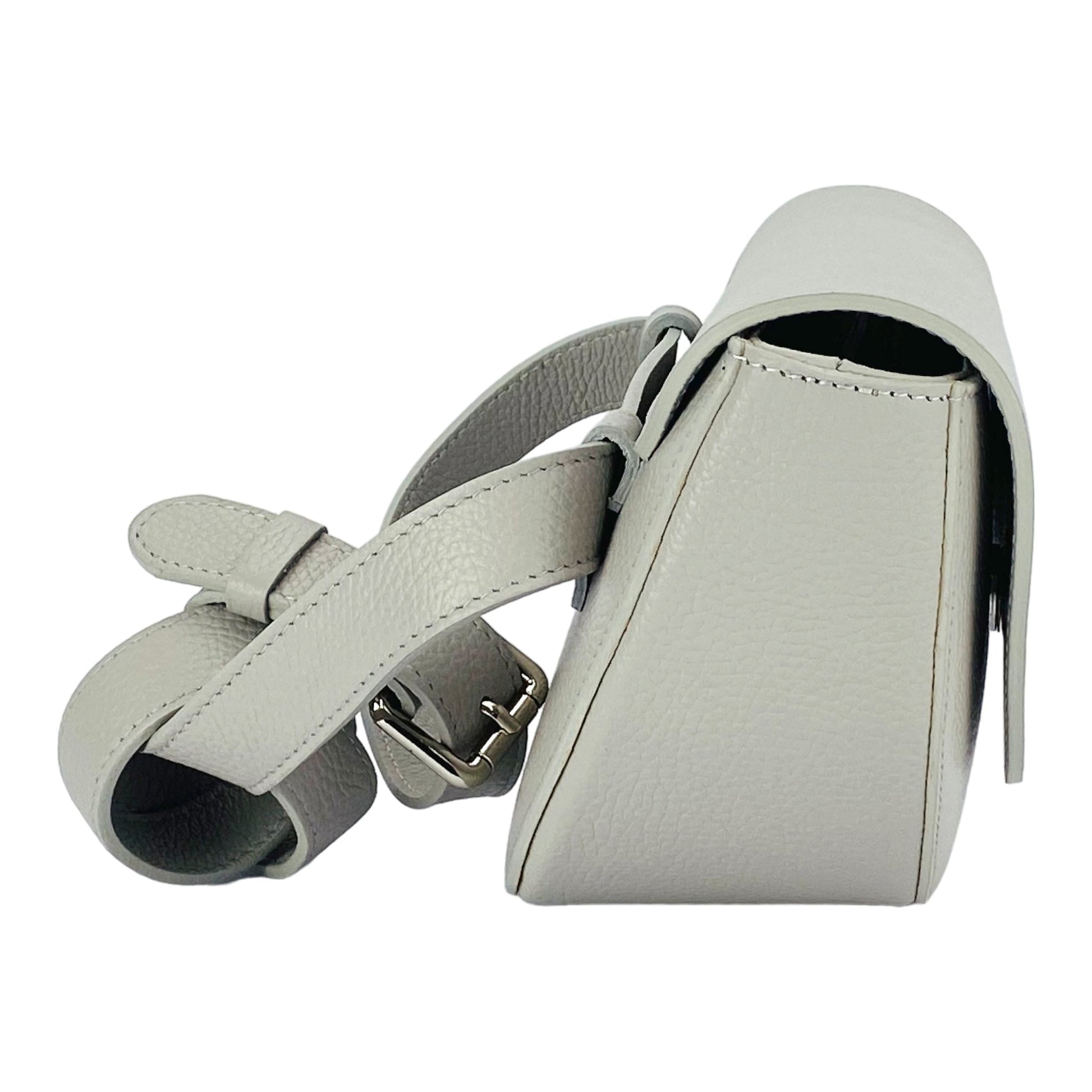 Light gray handbag with a strap on a white background