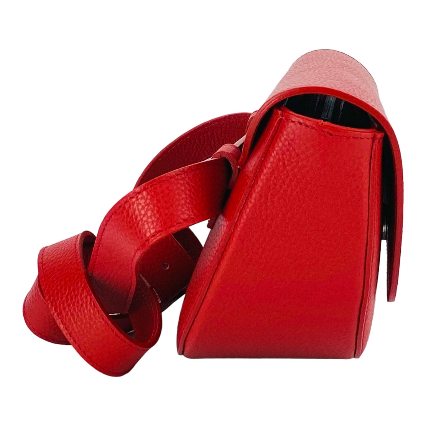 Red leather handbag with a strap on a white background