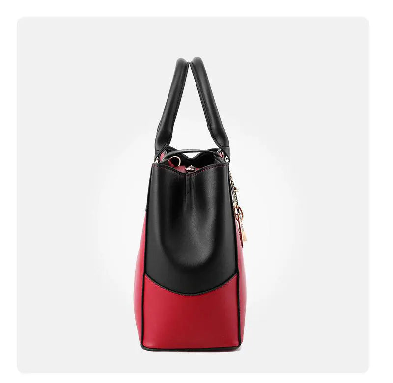 Black and red handbag on a white background