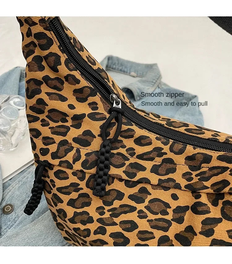 Leopard print fanny pack with a smooth zipper on a light background