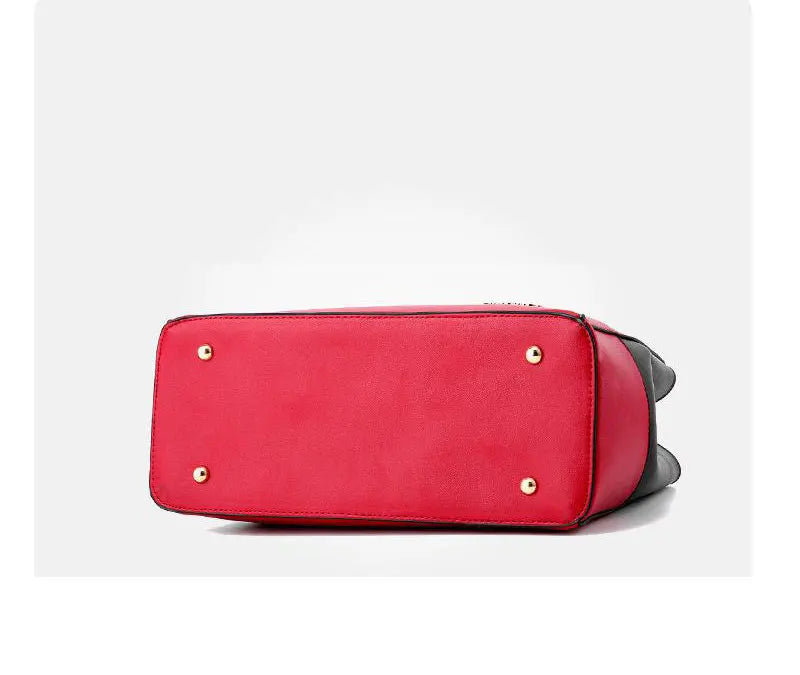 Red handbag with gold studs on a white background