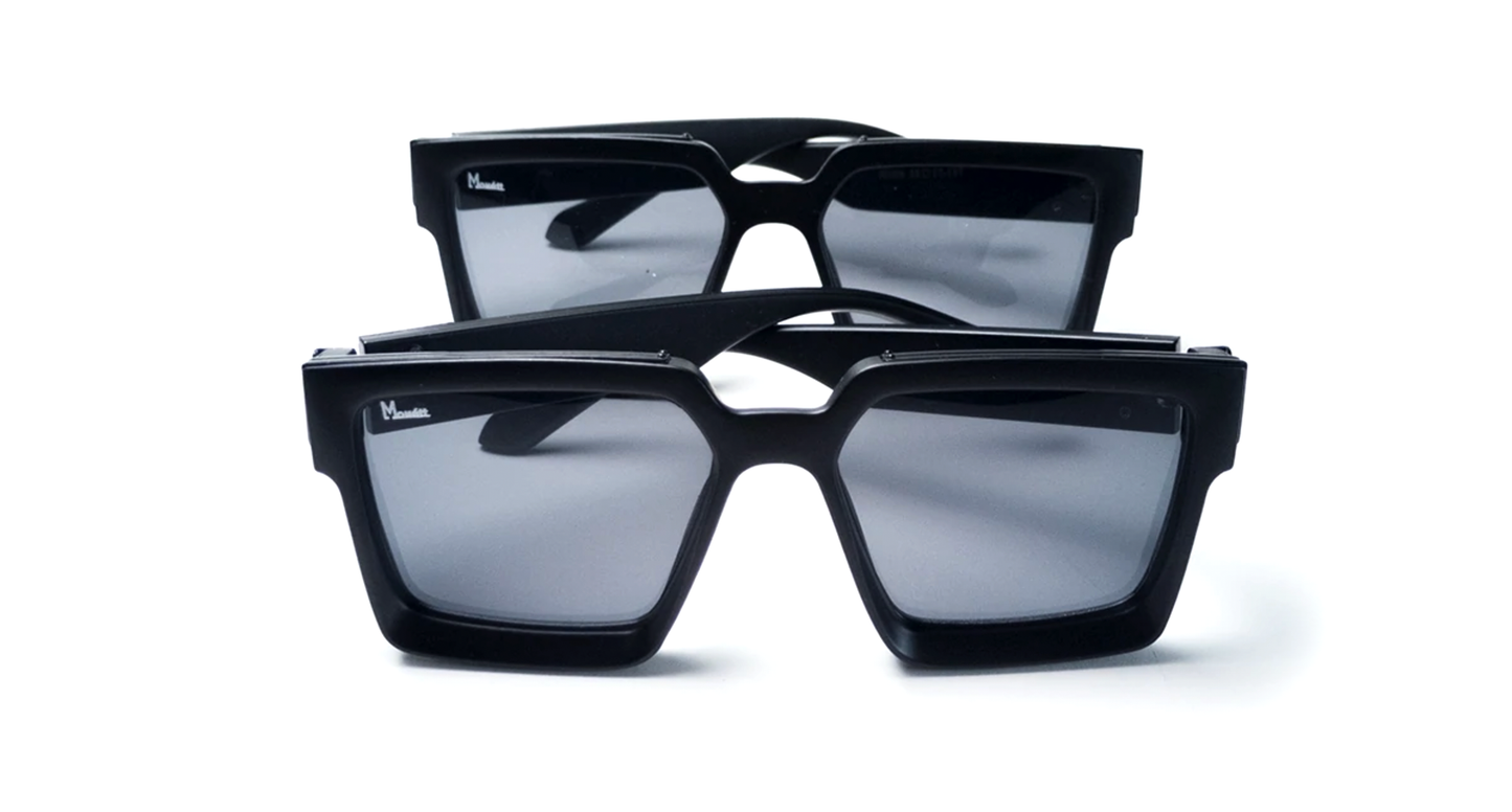 Black sunglasses with reflective lenses on a white background