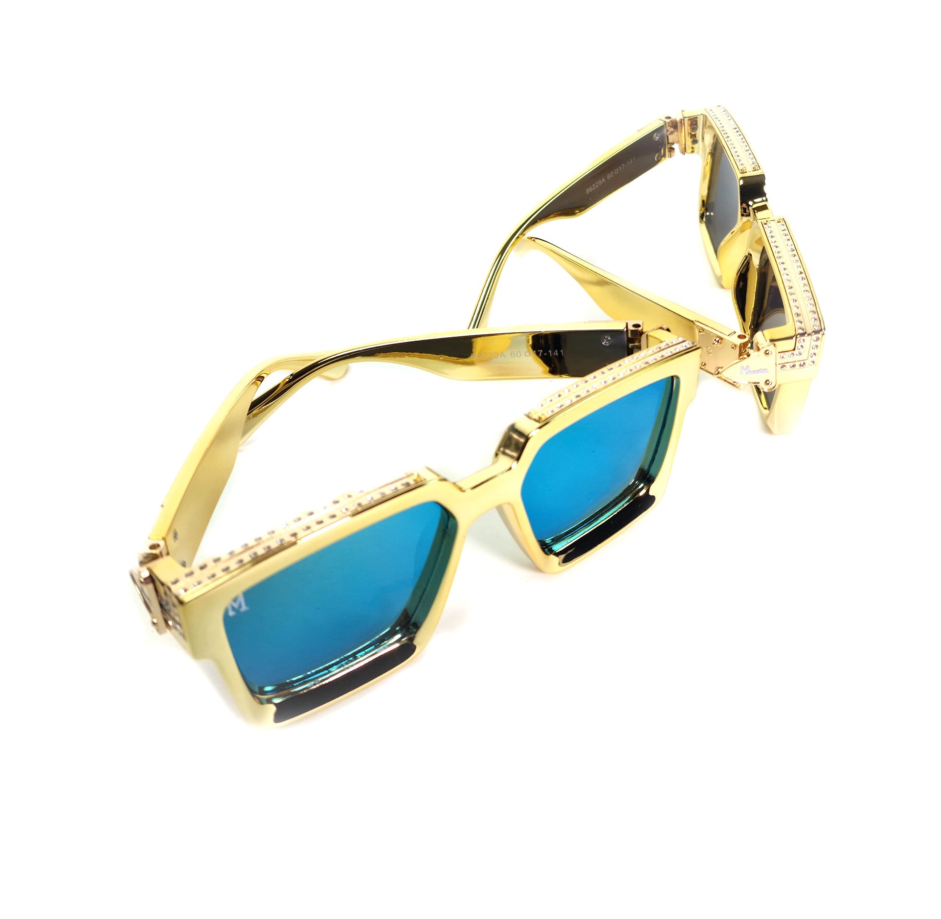 Gold-framed sunglasses with blue lenses on a white background