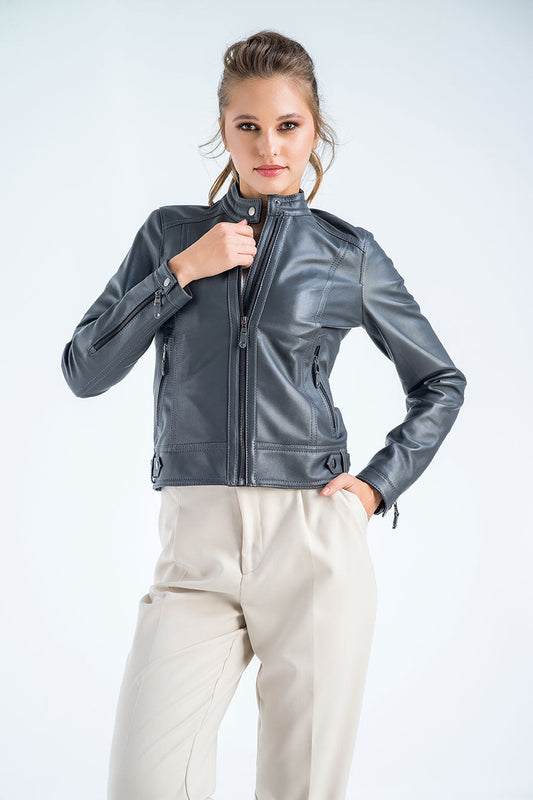 Woman wearing a gray leather jacket on a white background